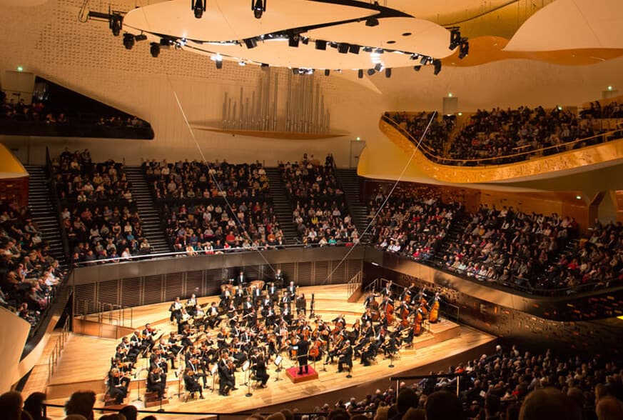 The main hall of the Philharmonie de Paris, with an orchestra on stage